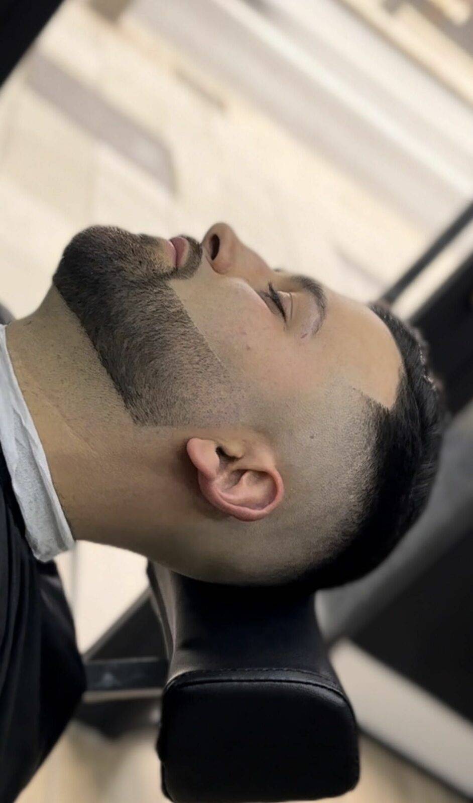 Straight-razor beard line-up with sharp jaw contour